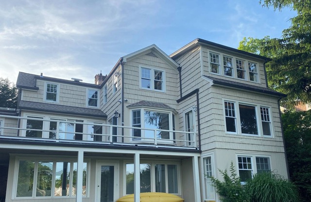 Stunning waterfront house with dock, walk to shops, restaurants, beach, train.