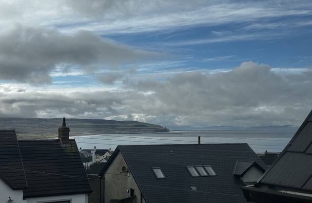 Stylish property with sea and golf course views