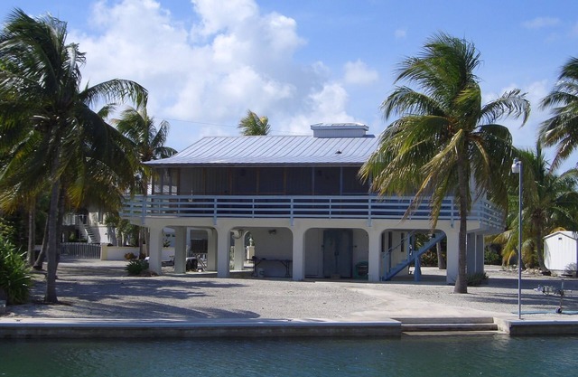 Sugarloaf Shores Wide Canal 3/3 Waterfront w/ 100 ft Seawall in Quite Community.