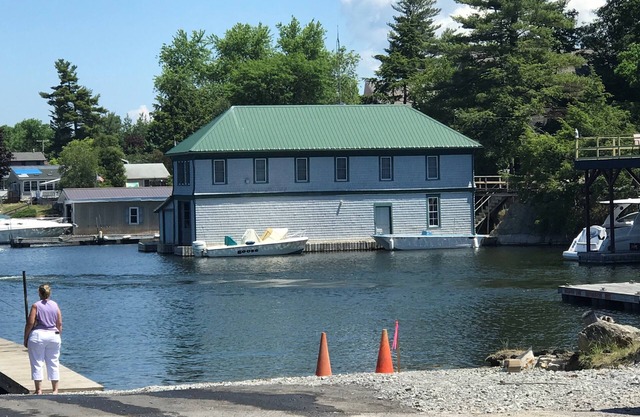 Sunny cottage built over the water on the St. Lawrence River