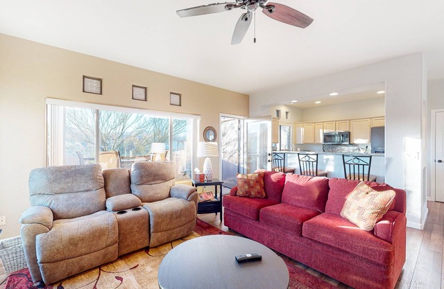 Sunny, dog-friendly condo with a heated pool, gym, grilling area, & golf nearby