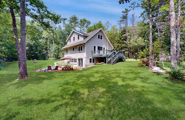 Sunny, lakefront home on South Pond with private dock, great deck & firepit
