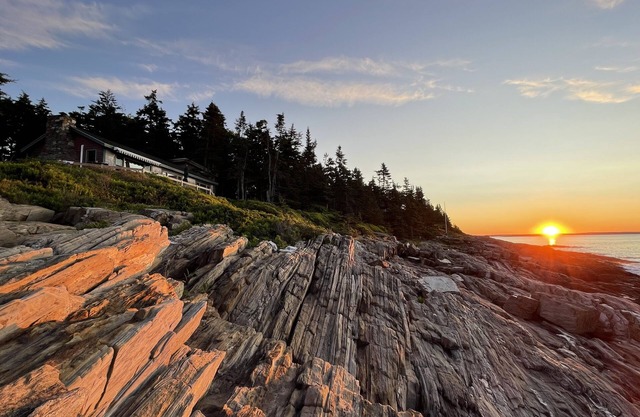 Sunrise Cottage. Relaxing waterfront deck on the rocky shore of Bailey Island.