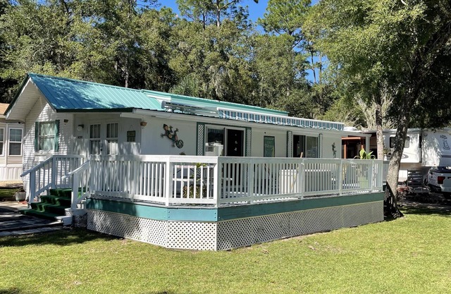 Super roomy Park Model in premier resort with lake, pools, dock and boat launch.