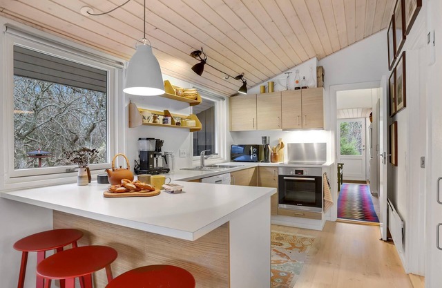 Surrounded by trees, this beautiful home is located on a private lot.