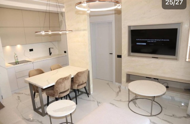 “Luxury apartment with jacuzzi on a spacious balcony”