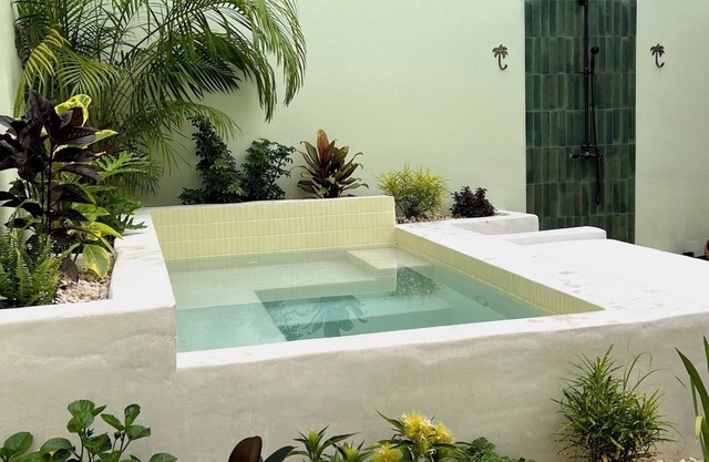 The Bungalows by HOUS offer a lush tropical paradise perfect for a relaxing romantic getaway.
