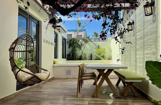 The Bungalows by HOUS offer a lush tropical paradise perfect for a relaxing getaway.