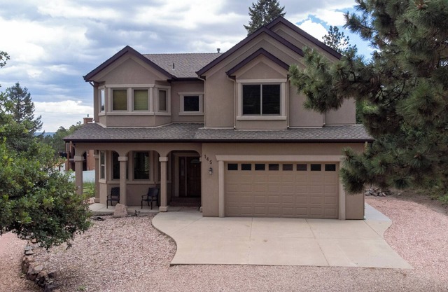 The Glen House, a lovely 4 bedroom home in Palmer Lake, with hot tub, and views!
