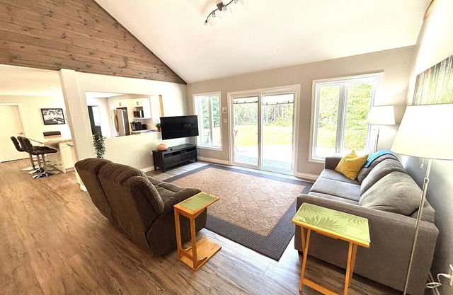 This bright and spacious retreat blends modern comfort with cozy cottage charm. Featuring a fully equipped kitchen, multiple cozy bedrooms, stylish bathrooms, and inviting living spaces with a wood-burning fireplace.