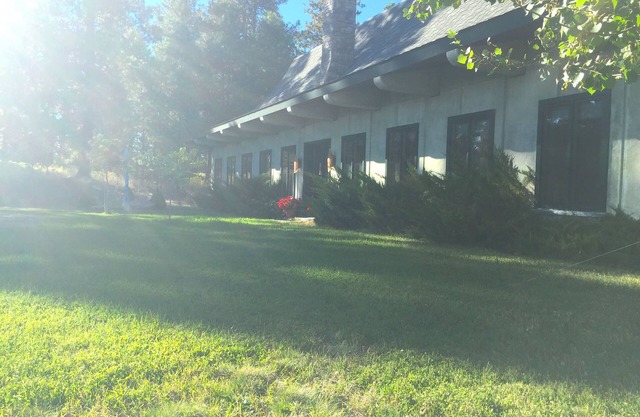 Timeless architecture, on 20 rolling acres, just minutes from Bigfork village.