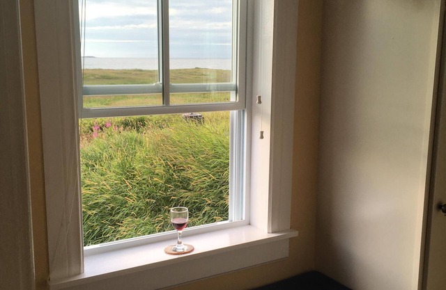 Traditionelles Haus mit Meerblick