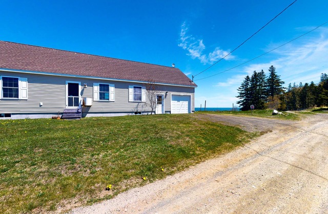 Tranquil getaway on the coast with beach access, ocean views, & screened porch