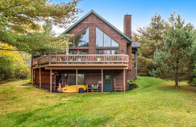 Tranquil lakefront oasis with private dock, canoe, kayak, & three living areas