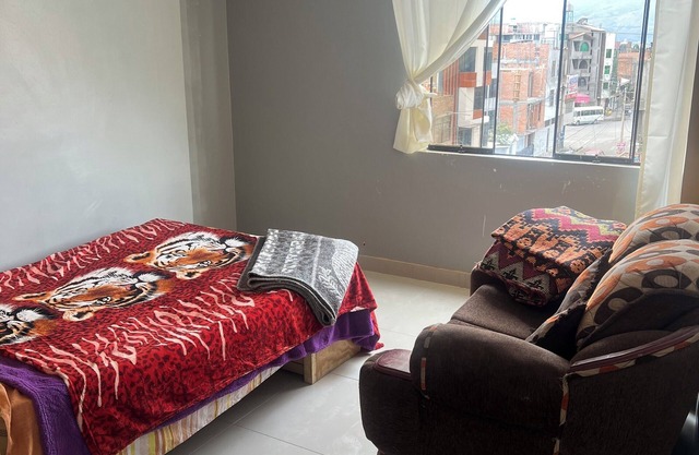 Travel's house in Cupaca has a shared living room and kitchen. For all V