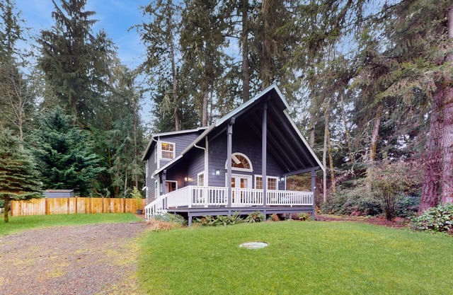 Tree-lined Anderson Island home with porch & fenced yard, near dock/tennis