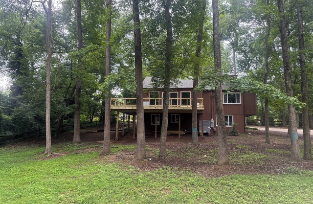 TREEHOUSE AVAILABLE JULY 1 A 5-bedroom with 2 driveways on 1.3 acres in City.