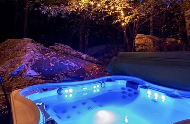 The Cliff House, a luxury treehouse with private hot tub and trout pond.