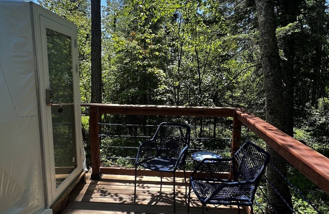 Two geodesic domes and one log cabin make the perfect glamping experience