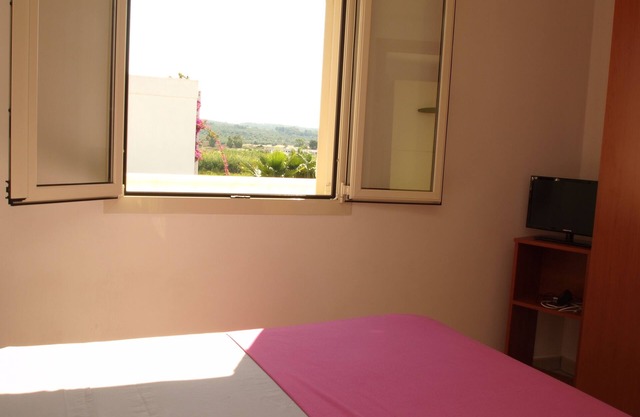 Zwei-Zimmer-Dachgeschosswohnung mit Aussicht nur 100 Meter vom Strand Torre Mozza entfernt