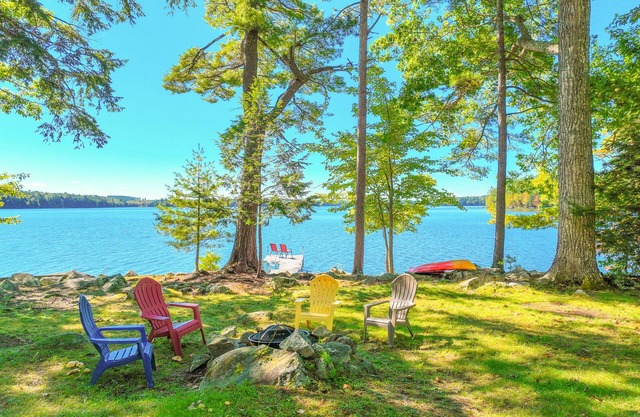 Two-story lakefront home with a seasonal dock, furnished deck, & washer/dryer