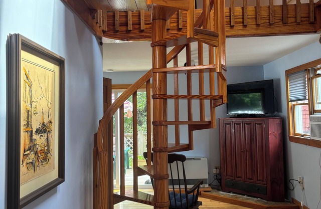Unique apartment with intricate woodwork and spiral staircase. 5 miles to beach!