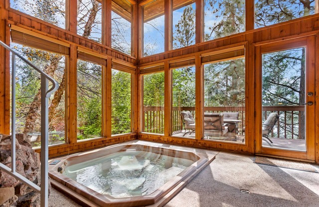 Unique lakefront hideaway with four decks, dock, private hot tub & wood stove