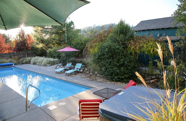 Unique Property: pool, hot tub, gardens, koi ponds, game building!