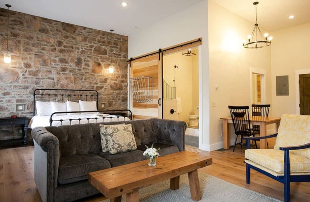 Unique Rustic Suite with Jacuzzi Tub, Kitchen, Fireplace, and Living Room