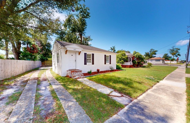 Updated home 3 blocks from the beach with private yard, AC, & W/D