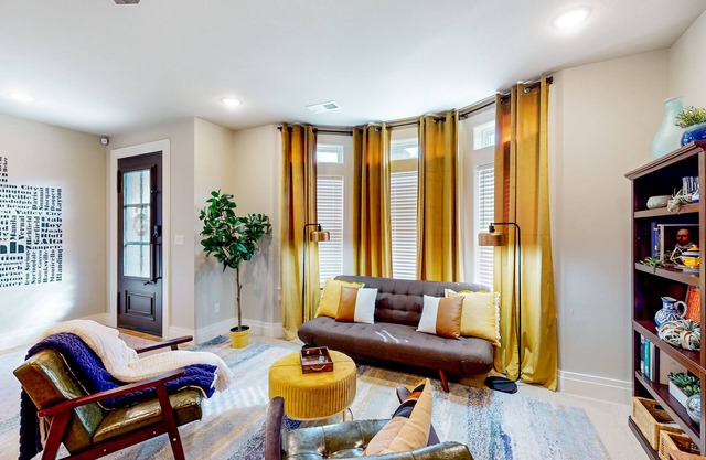 Updated townhome with ensuite bedrooms, workstation, & aquatic center pass
