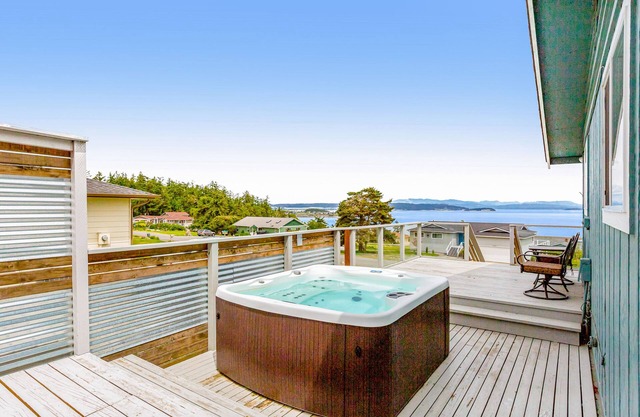 Updated Water View Gem with Deck, BBQ/Outdoor Dining, Hot Tub, Fireplace, & WiFi