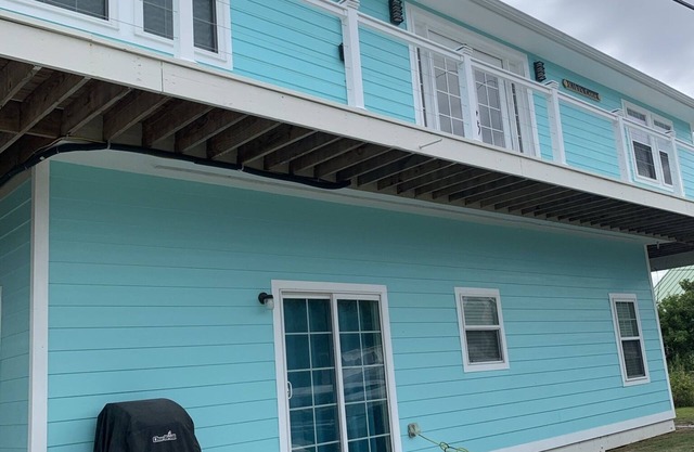 New upstairs 3 BR, 2 bath home, 150 yds from beach with beautiful clear water.