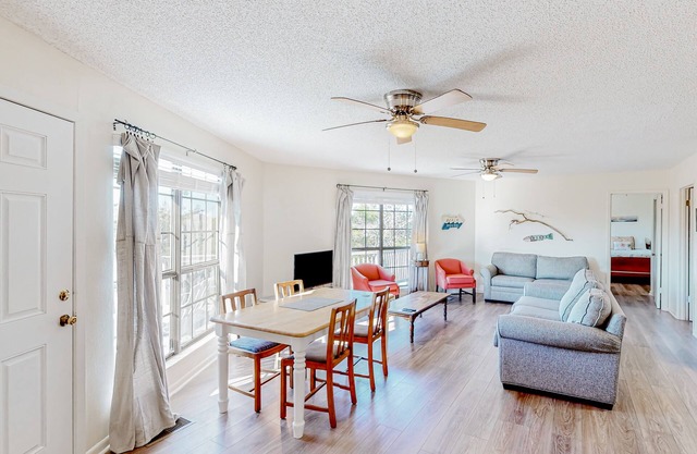 Upstairs duplex near the beach with deck, outdoor shower, W/D, streaming, & AC