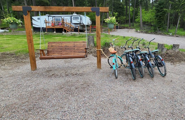 Vacation Camper with private area behind with Seating, Firepit, and Hot tub