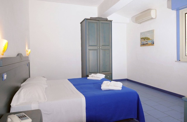 Vacation Home "Oasi Azzurra - Bilocale Plus 1" with Sea View, Shared Pool & Shared Terraces