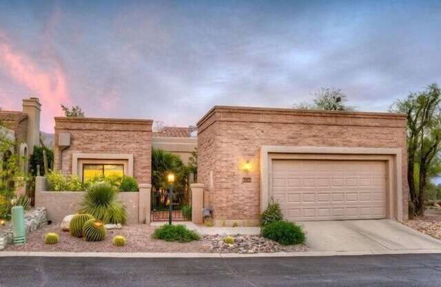 Ventana Canyon Golf Course at your fingertips from this stunning private home