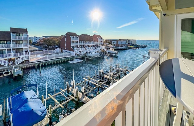 Vibrant waterfront condo with canal views, pools, & private balcony