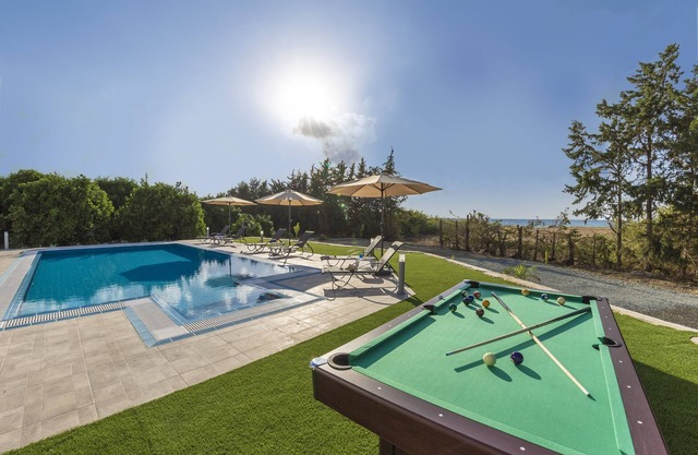 Villa Ammoyiali on the Beach - a large modern villa that sleeps 8 guests in 4 bedrooms