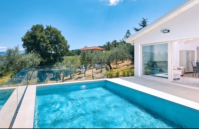 Charming modern villa with private pool surrounded by nature