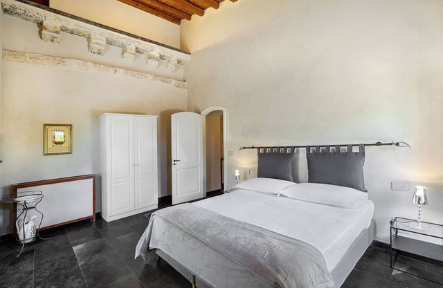 Villa Siliqua stands on a scenic hill surrounded by nature.