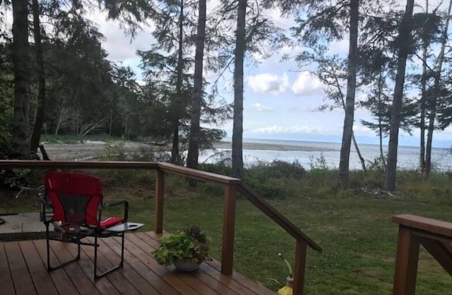 Walk out the front door, across a grass lawn and onto a sandy beach