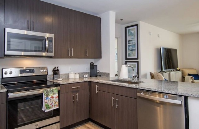 Walk to the square and the grove! This 2BR 2BA is the perfect location.
