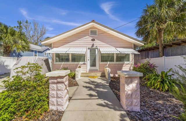 Walkable bayside home with private dock and large outdoor living area