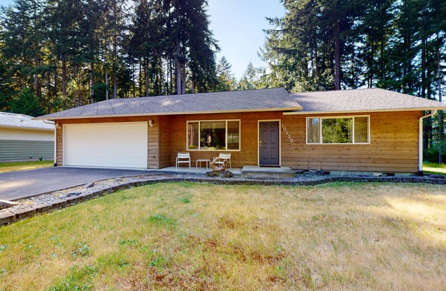 Water-view home & bunkhouse with lake access, canoe, kayaks, firepit, & W/D