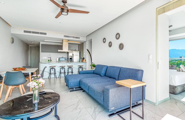 Waterfront 9th-floor condo with rooftop pool, gym, balcony, marina views, & W/D