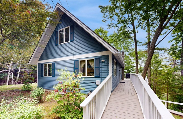 Waterfront, dog-friendly home with dock access, river views, deck & sunroom