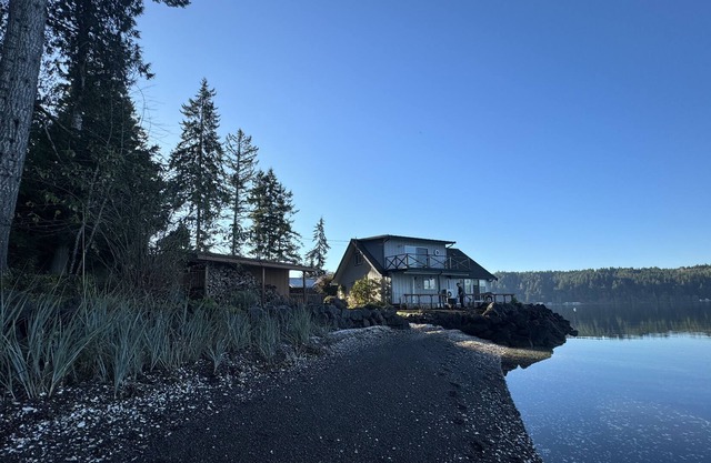 Waterfront family home w/ private beach, cozy woodstove, kayak. Dog-friendly!