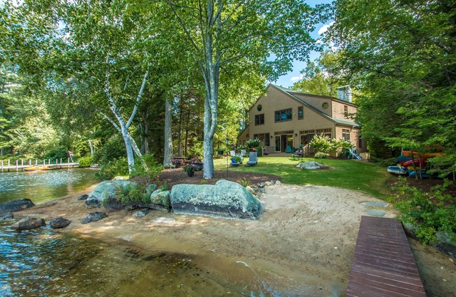 Waterfront home in Moultonborough with sandy beach and dock
