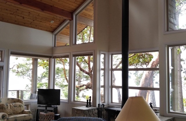 Waterfront home with stunning views, surrounded by nature.